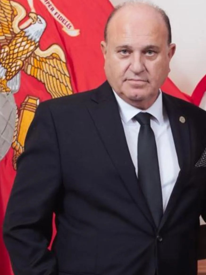 Yoram Naor with USMC flag at the 250th Anniversary of the Marine Corps