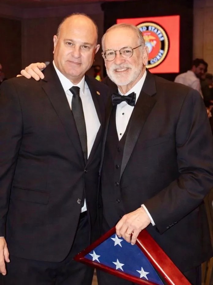 Yoram Naor, Honorary Consul General and VP of the Ambassador Clubs of Israel, and US Ambassador Mike Huckabee hug