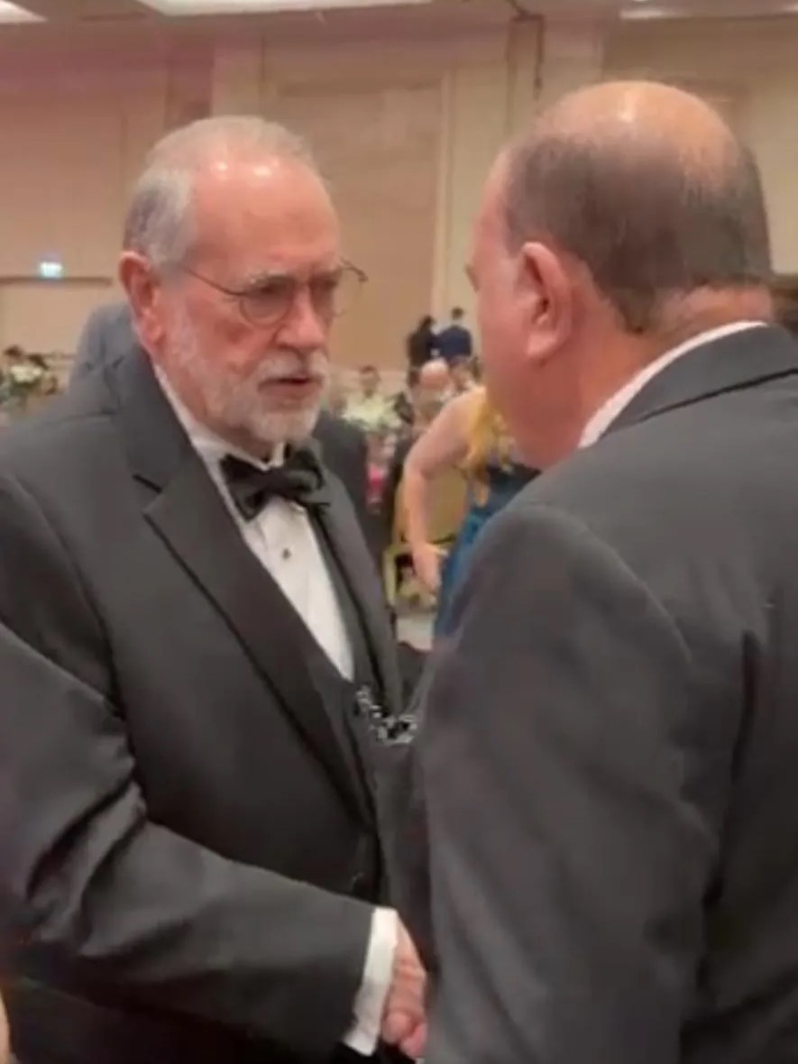 Yoram Naor, Honorary Consul General and VP of the Ambassador Clubs of Israel, and US Ambassador Mike Huckabee shake hands